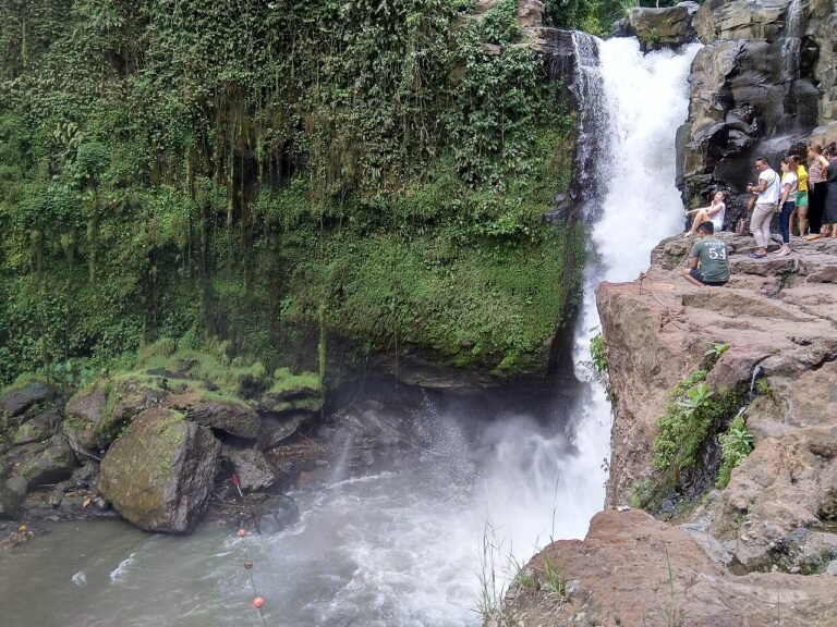 Waterfall seen from the rocky path beside the cascade