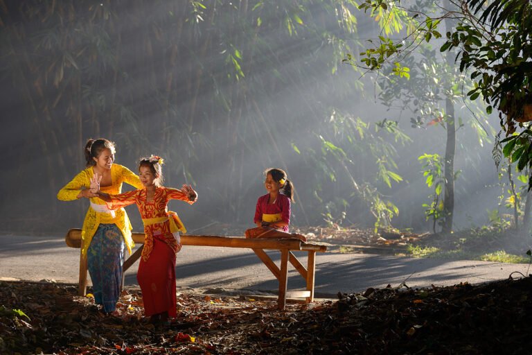 Balinese dance practice beside bamboo trees at Penglipuran, Bali